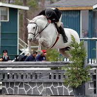 Holly Shepherd pilots Belvedere over a fence during the $2,500 USHJA Hunter Derby Friday. Flashpoint Photography