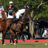 Marc Ganzi fights for possession of the ball with teammate Gonzalito Pieres following him up