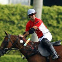 Nico Pieres hits the ball in mid-air on a neck shot to his brother Gonzalito Pieres