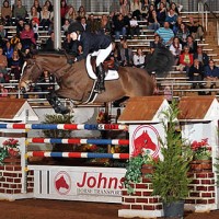 Frances Land clears the Johnson Horse Transportation oxer to the delight of the crowd last winter in Pensacola