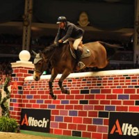 Winners Luca Moneta & Quovo de Vains clear the 7 ft. 2 in. Puissance wall