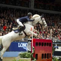 Maikel Van der Vleuten (NED) clears the London 2012 Bus to claim victory in the Longines FEI World Cup Leg