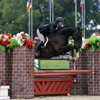©ESI Photography. Katie Cooper and Color Up jump to a win in the $1,500 Platinum Performance Hunter Prix