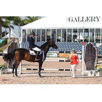 Emanuel Andrade is presented with a $1,000 bonus from SSG Gloves after winning the $10,000 High Junior Jumper Classic. Photo by Sportfot
