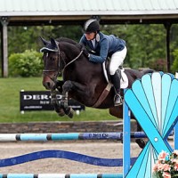 ©ESI Photography. Alissa Kinsey and Grisset jump to a win in the $10,000 M&S Child/Adult Jumper Classic