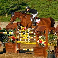 Liza Finsness and her own Ormsby Hill tackle the $35,000 Adequan Grand Prix course designed by legendary Steve Stephens