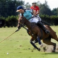 Kris Kampsen (3) of Palm House leans into his shot with Audi's Juan Bollini (3) and Luis Escobar (3) defending
