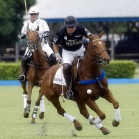 Piaget's Melissa Ganzi (1) chases down Beluga's Michel Dorignac (4) as he tries maintain ball possession