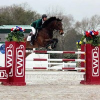 Cookie Monster and Ryan Genn clear the CWD jump last Sunday at the Harrison County Fairgrounds. Photo by MH Hamm