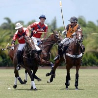 Pony Express teammates Tomas Goti and Pancho Eddy try to mount an offensive attack with Carlos Gracida Jr. of Palm Beach Polo defending