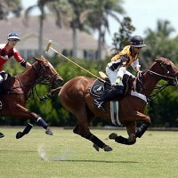 Carlos Gracida Jr. of Palm Beach Polo races towards goal with Justin Daniels of Pony Express defending