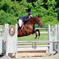 ©ESI Photography. Kathryn Haefner and Columbus jump to a win in the $1,500 Platinum Performance Hunter Prix