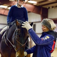 Mary King works with clinic attendee Erin Nolan and Highland Casino