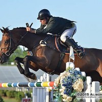 Vale and Acolina R sail over an oxer.