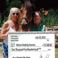 Board President Jessica Morrissey (left) & Any D. Bodelin (right), with Ruby
