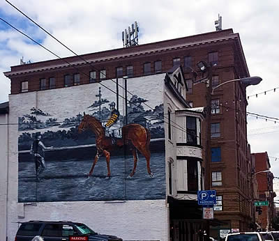 Man o’ War Commemorative Mural Painted on The Village Idiot