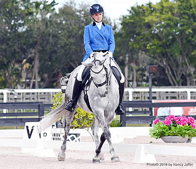 Bridget Hay Flying US-Bred Flag in Dressage Ring